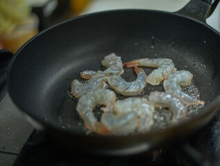 shrimp pan-fried in a restaurant kitchen