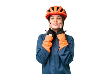 Young cyclist girl over isolated chroma key background smiling with a happy and pleasant expression