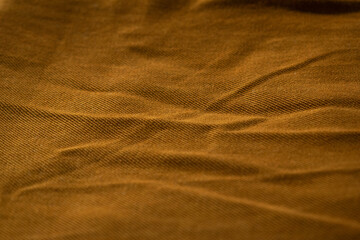 Detailed bright brown jeans fabric background texture.