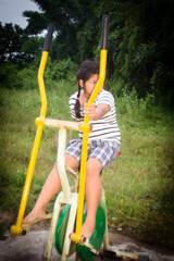 asia girl with exercise equipment outdoor thai style