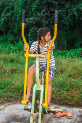 asia girl with exercise equipment outdoor thai style