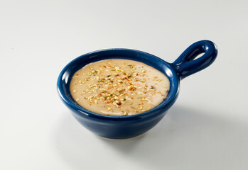 Salad sauce in small bowl isolated on white background