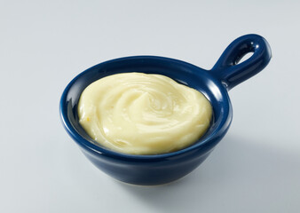 Salad sauce in small bowl isolated on white background