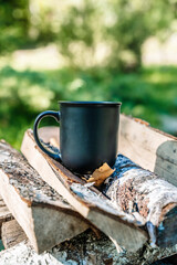 Cup of hot drink in nature outdoor camp 