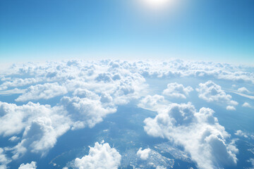 A serene cloudscape featuring a blanket of soft, fluffy clouds spread across a clear blue sky.