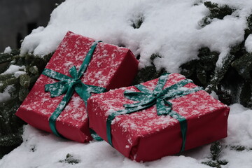 christmas gifts  boxes under snow 