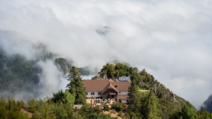 View on mountain hut located on the mountain summit shrouded in clouds, Madeira, Portugal