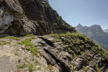 Two Hikers Pause To Collect Water Along Boulder Pass Trail