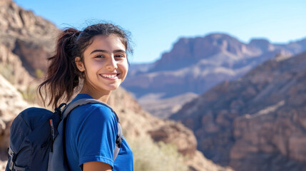 Naklejka premium Arabian girl in blue athleisure doing outdoor activity at grand canyon