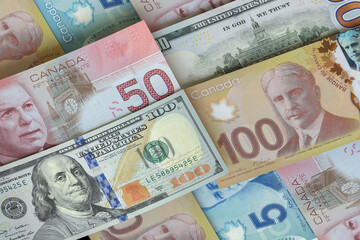 US dollar and Canadian dollar bills. Cash. Financial Concept.