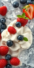 Creamy dessert topped with fresh berries and mint leaves on crushed ice for a refreshing summer treat