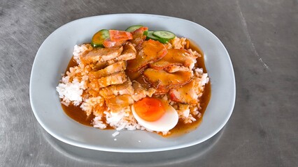Red pork and crispy pork on rice, food in Thailand