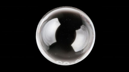 Clear Glass Sphere on Black Background Reflects Light and Shadows