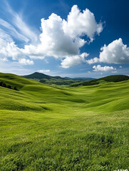 Fototapeta premium Vast green hills under a bright blue sky