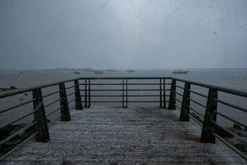 Snow - covered pier in December