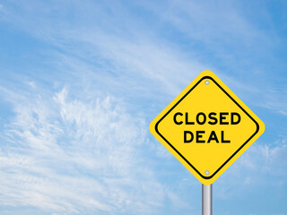 Yellow transportation sign with word closed deal on blue color sky background