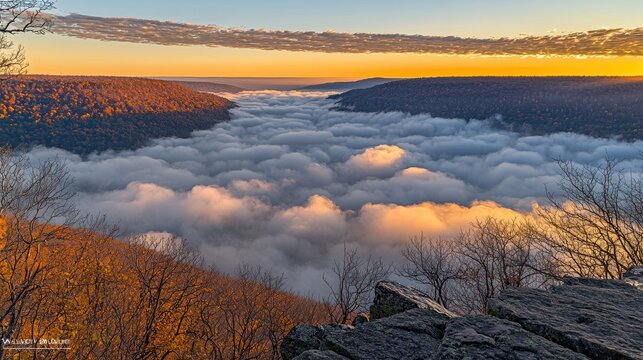 A breathtaking view from a mountaintop during golden hour, with rolling hills bathed in warm sunlight and a sea of clouds below. The sense of height and the vast expanse of nature evoke feelings 