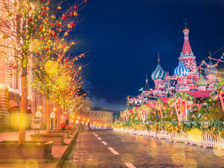 Obraz premium Christmas Moscow. Winter Russia. Red square. New year fair. Christmas landscape Moscow. Trees with garlands on red square. Christmas festivities in Russia. New year eve in Russian federation