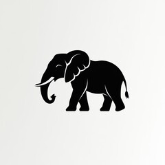 Obraz premium Silhouette of an African elephant walking, simple black and white design.