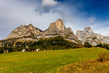 Autumn mountains. Alps in autumn colors. Dolomites beautiful yellow tree leaves autumn landscape. Alpine scenery of golden autumn