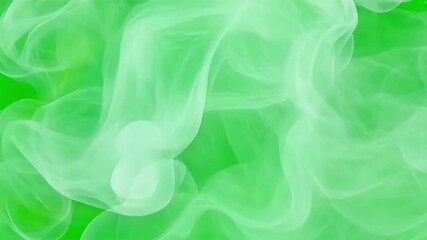 Abstract white smoke swirls on chroma key green screen alpha channel background. Ethereal and dreamy.