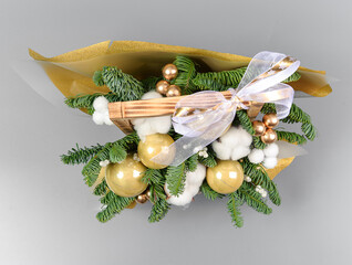 A traditional Christmas floral arrangement of green fir branches and flowers. New Year's decor for the interior