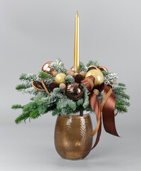 A traditional Christmas floral arrangement of green fir branches and flowers. New Year's decor for the interior