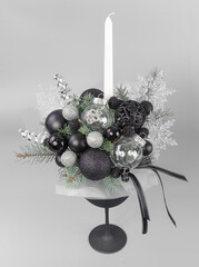 A traditional Christmas floral arrangement of green fir branches and flowers. New Year's decor for the interior