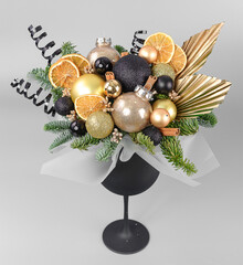 A traditional Christmas floral arrangement of green fir branches and flowers. New Year's decor for the interior