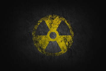 Radioactive sign on old brick wall. Hazard symbol