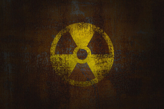 Radioactive sign on old brick wall. Hazard symbol