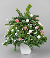 A traditional Christmas floral arrangement of green fir branches and flowers. New Year's decor for the interior