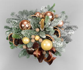 A traditional Christmas floral arrangement of green fir branches and flowers. New Year's decor for the interior