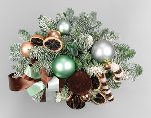 A traditional Christmas floral arrangement of green fir branches and flowers. New Year's decor for the interior