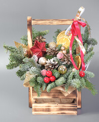 A traditional Christmas floral arrangement of green fir branches and flowers. New Year's decor for the interior