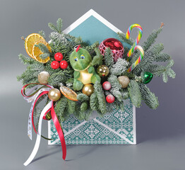A traditional Christmas floral arrangement of green fir branches and flowers. New Year's decor for the interior
