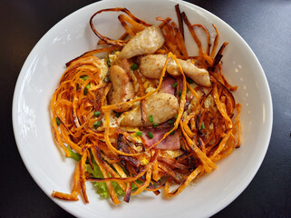 Stir Fried taro noodles with chicken top view image