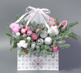 A traditional Christmas floral arrangement of green fir branches and flowers. New Year's decor for the interior