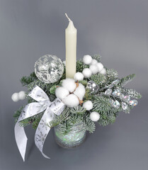 A traditional Christmas floral arrangement of green fir branches and flowers. New Year's decor for the interior