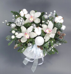 A traditional Christmas floral arrangement of green fir branches and flowers. New Year's decor for the interior