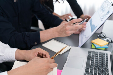 Data analysts team of office worker collaborate on business intelligence BI dashboard to analyze financial, trend, and marketing data. BI software utilization drive business success. Prudent