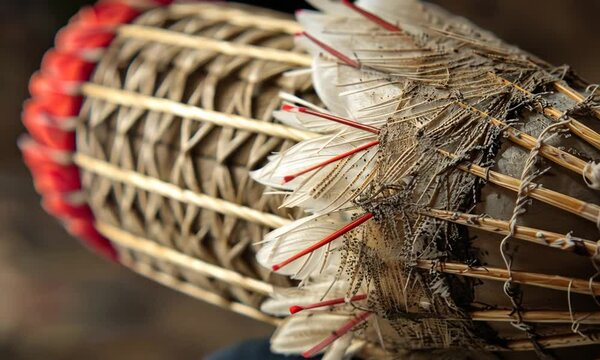 Close-up of a Vintage Shuttlecock: A Detailed Look at its Worn Feathers and Bamboo Structure