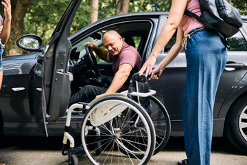 Woman Helping Man With Disability