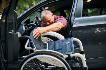 Man in Wheelchair Transitioning into Car