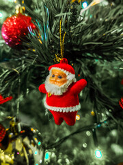 Santa Doll Ornament Hanging on Christmas Tree