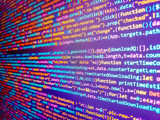 Flight schedule information board at airport. Code background. Compressed javascript code on computer screen. Blue background with computer digital binary code bit number one and zero text.
