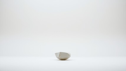 A Small, Faceted, Light Grey Ceramic Bowl on a White Background