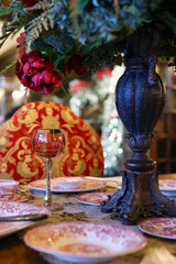 Elegant Dining Table with Ornate Decor and Red Accents