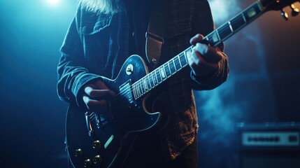 Obraz premium musician playing electric guitar on stage