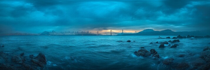 Obraz premium Golden Hour Serenity over the Bay Bridge: A Majestic Panorama of the Cityscape
